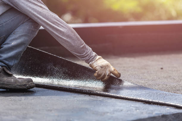 Professional Basement Waterproofing technician working in Augusta, KS